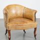 Antique sheep leather club chair/armchair on wheels