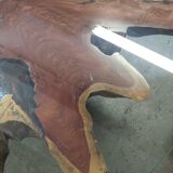 Round table carved from a wooden slice of PADOUK