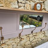 Coat rack or wall-mounted entrance wardrobe with scroll arms and antique hooks.