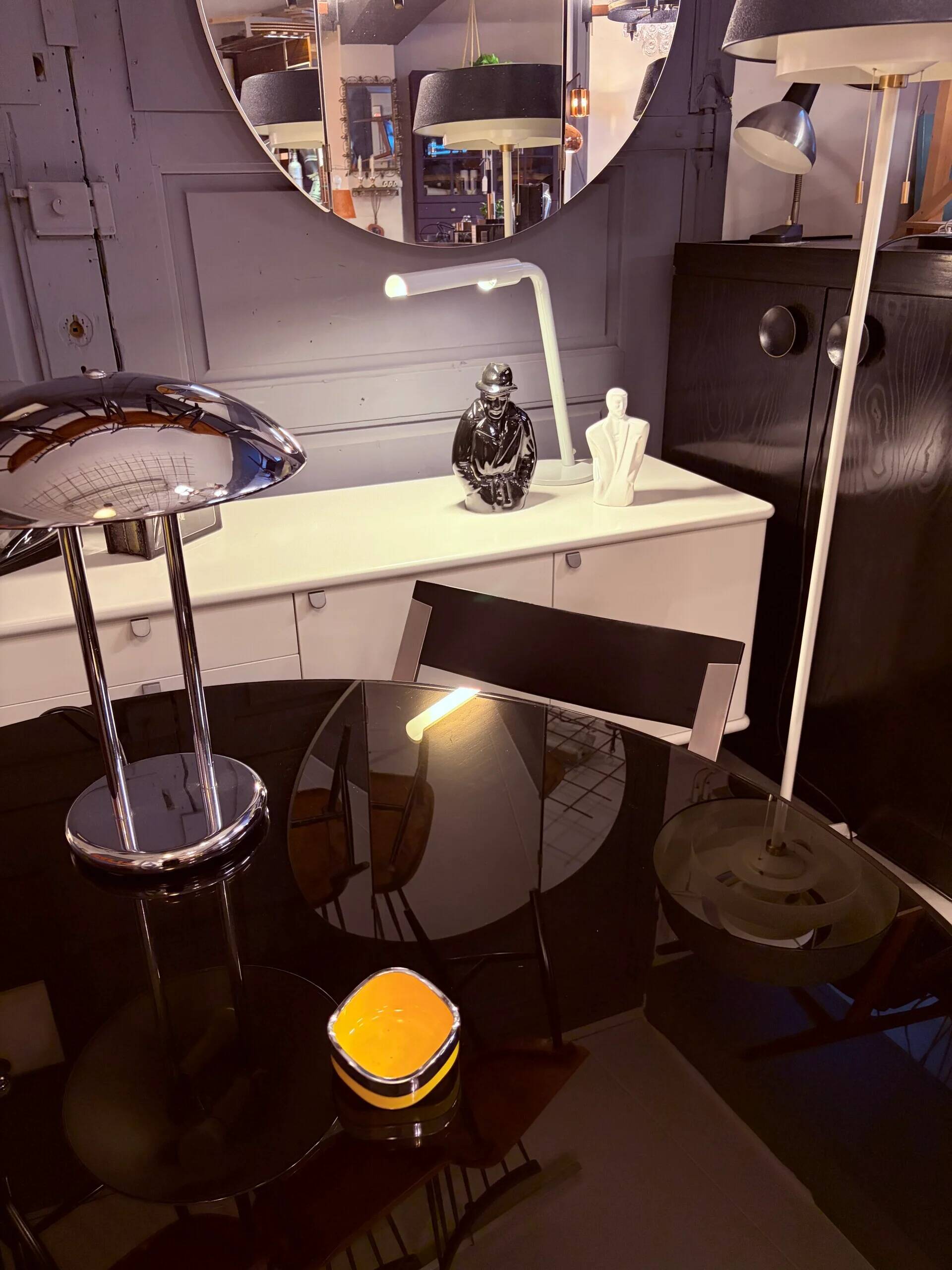 Round dining table, 1980s, black stained wood with glass top