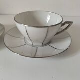 Two Art Deco porcelain cups and saucers with silver trim.