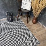 Romanian floral rug handwoven in wool, white and black background