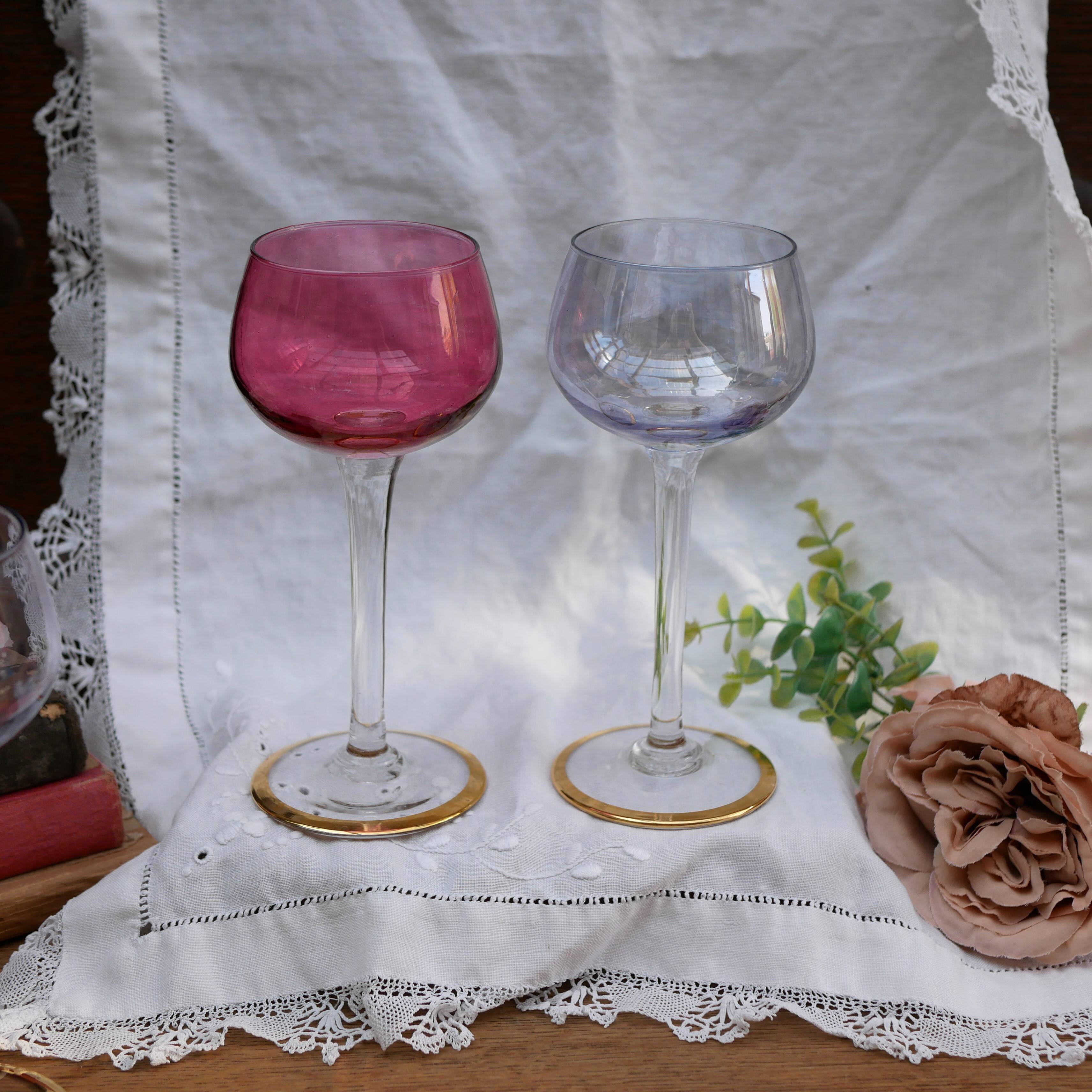 Four colorful stemmed wine glasses