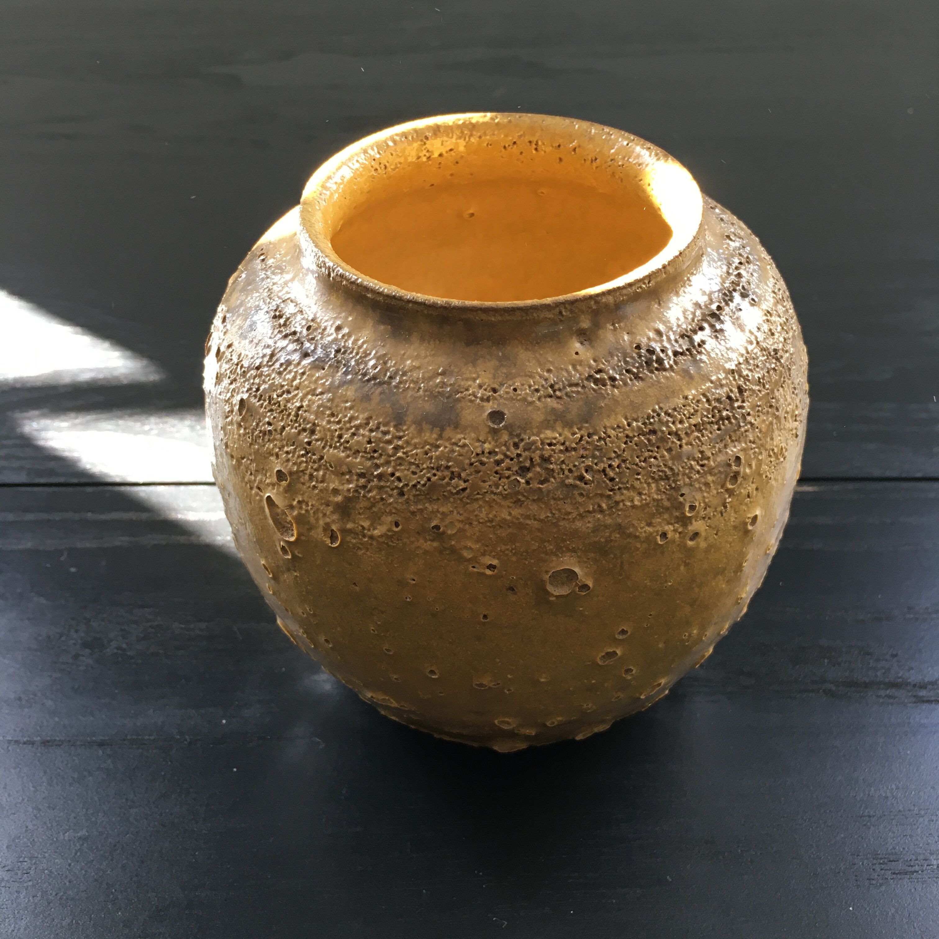 Relief crater ball vase