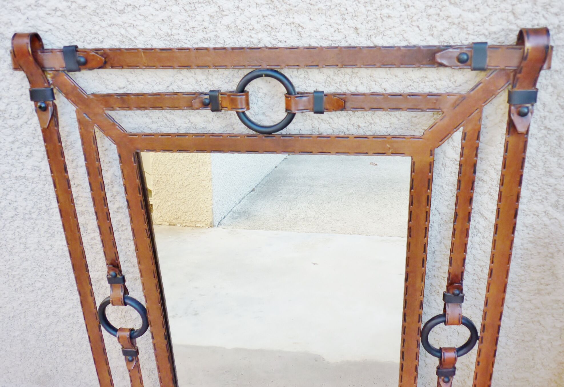 Metal mirror, wrought iron imitation leather straps and horse harness
