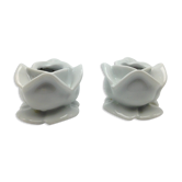 pair of white APILCO porcelain candlesticks in the shape of pink flowers