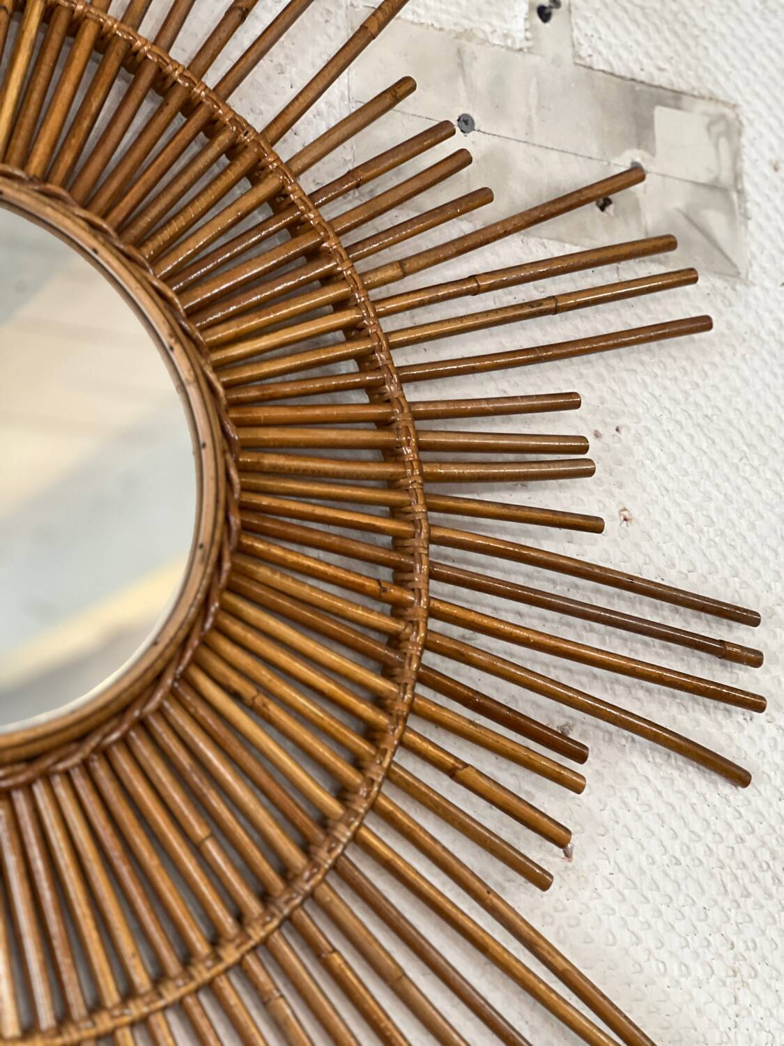 Large sun mirror in rattan