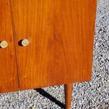 Vintage golden oak sideboard with conical legs from the 1950s