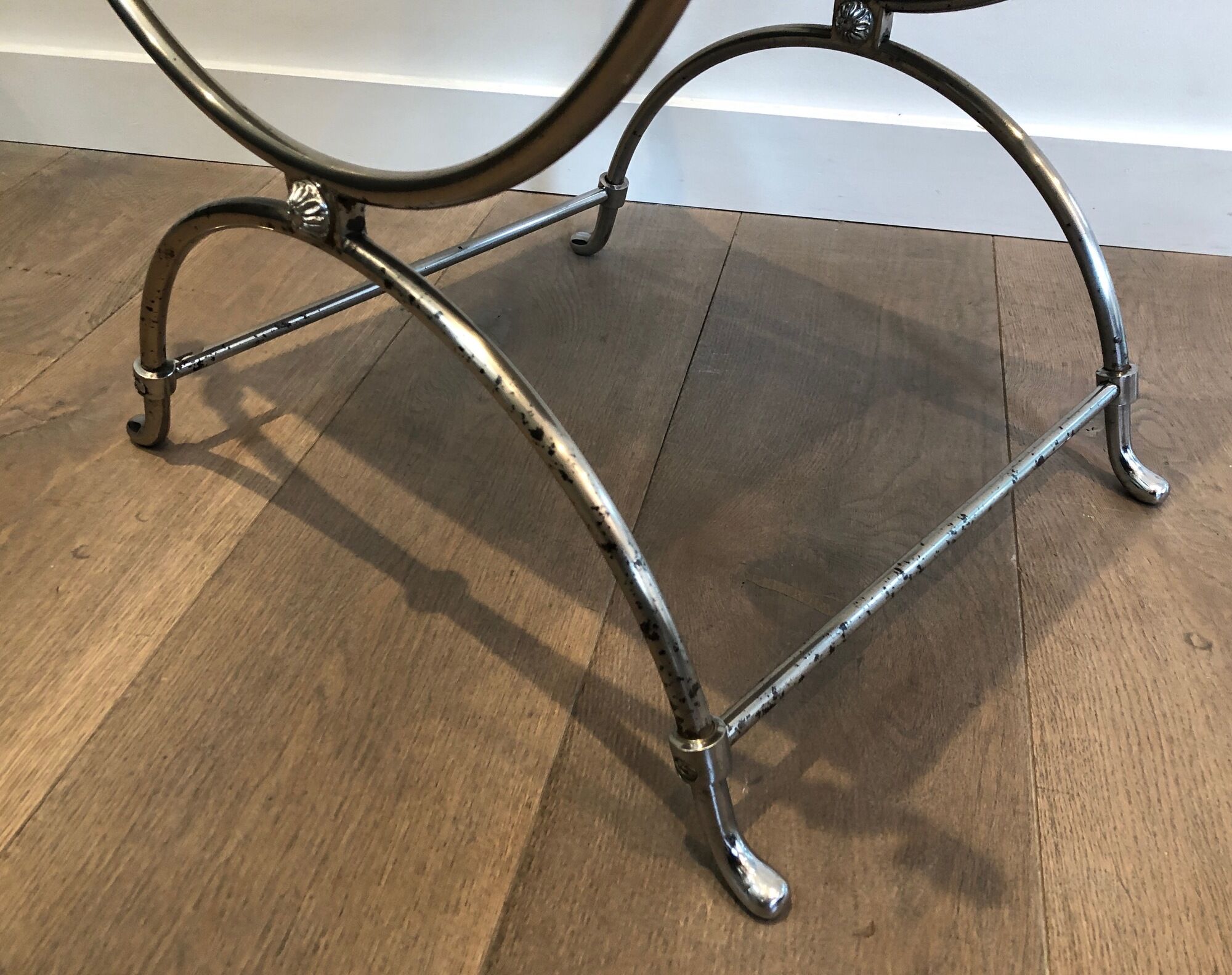 Curule stool in silver steel neoclassical style with swan heads