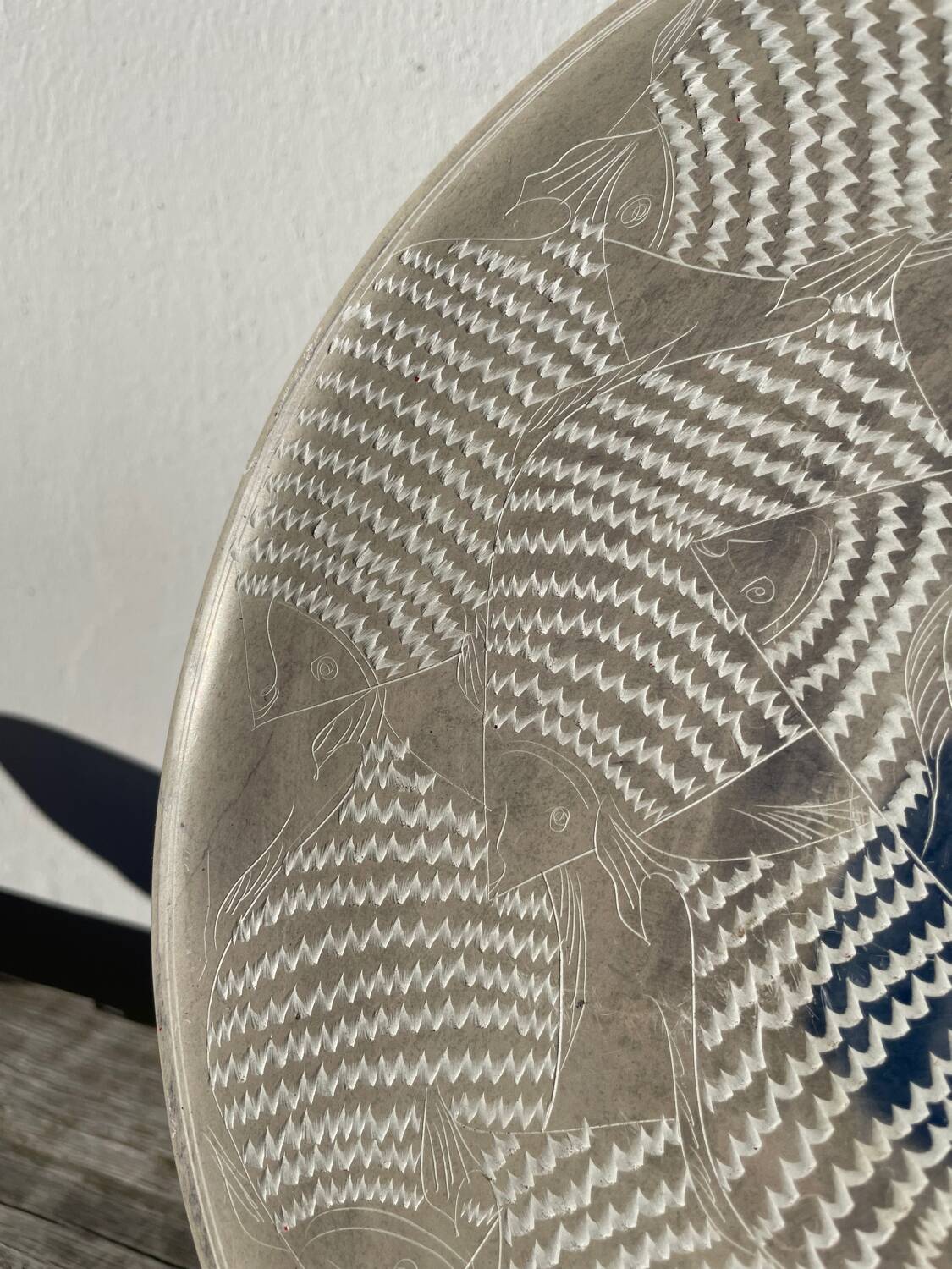 Ethnic handmade round fish dish