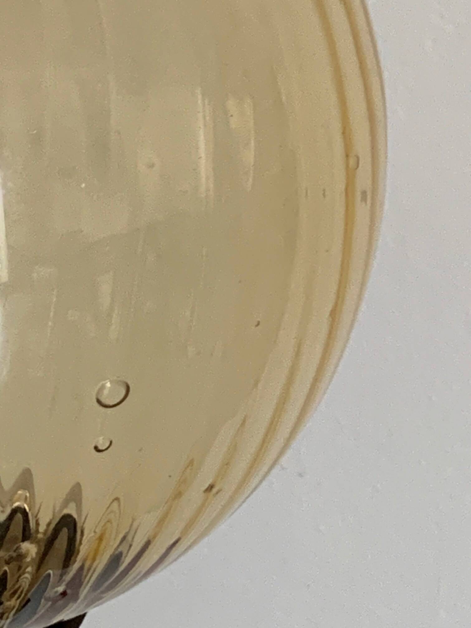 Table lamp with an antique gold glass lampshade