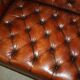 Pair of Early Victorian leather Chesterfield sofas by George Smith.