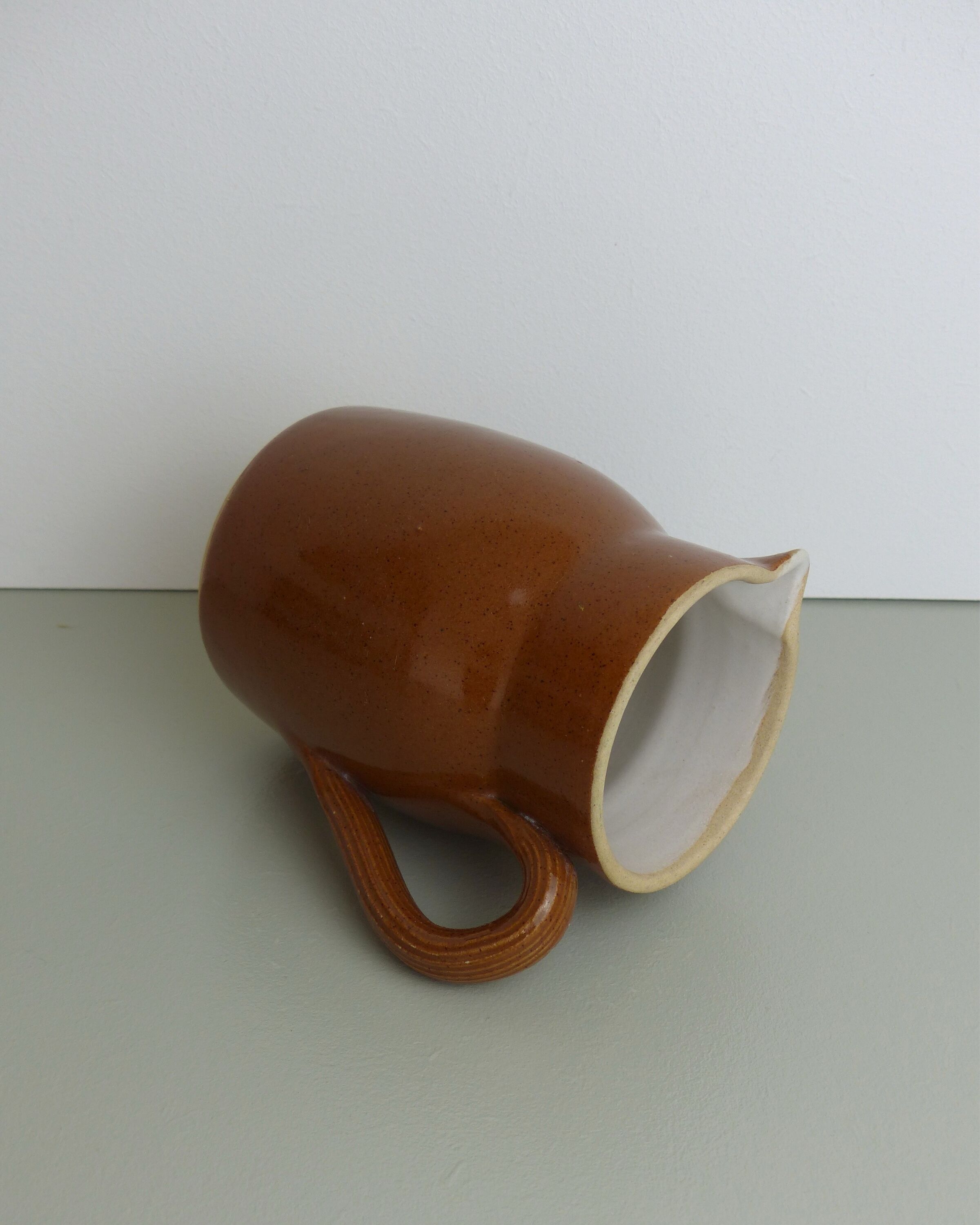 Pitcher or milk pot in speckled enamelled sandstone