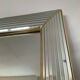 Large vintage Hollywood Regency style mirror with shutters.