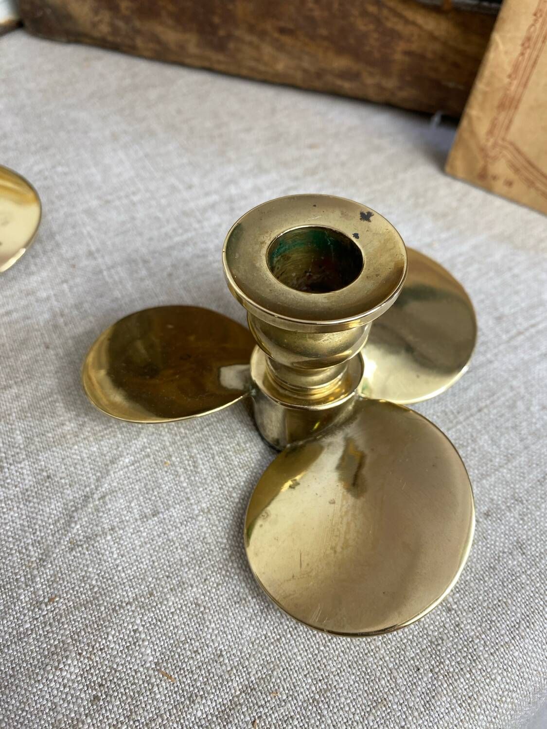 Pair of vintage brass propeller-shaped candlesticks