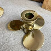 Pair of vintage brass propeller-shaped candlesticks