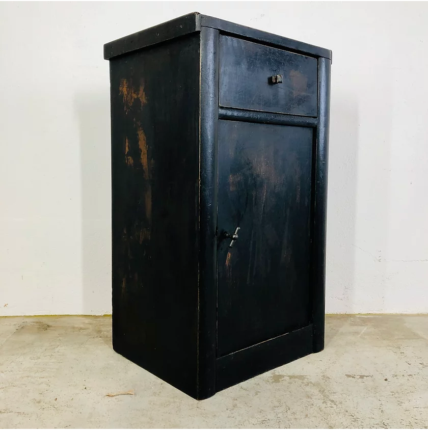 Antique black patinated bedside table