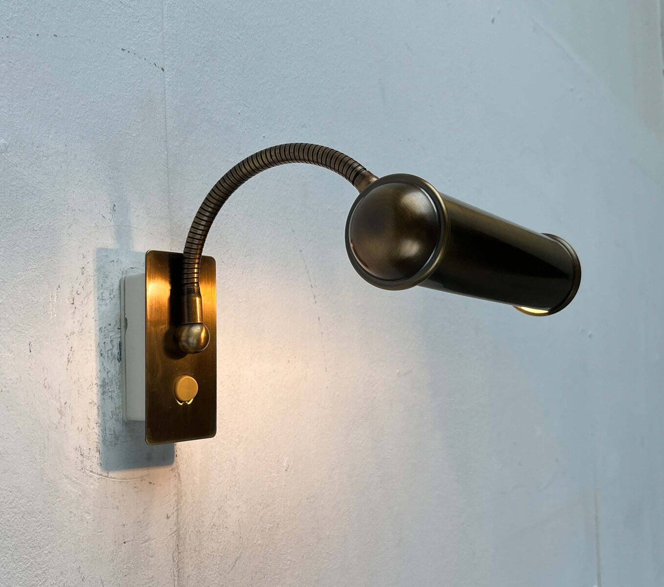 Vintage German brass patinated wall lamp with a gooseneck design by Honsel, 1970s.