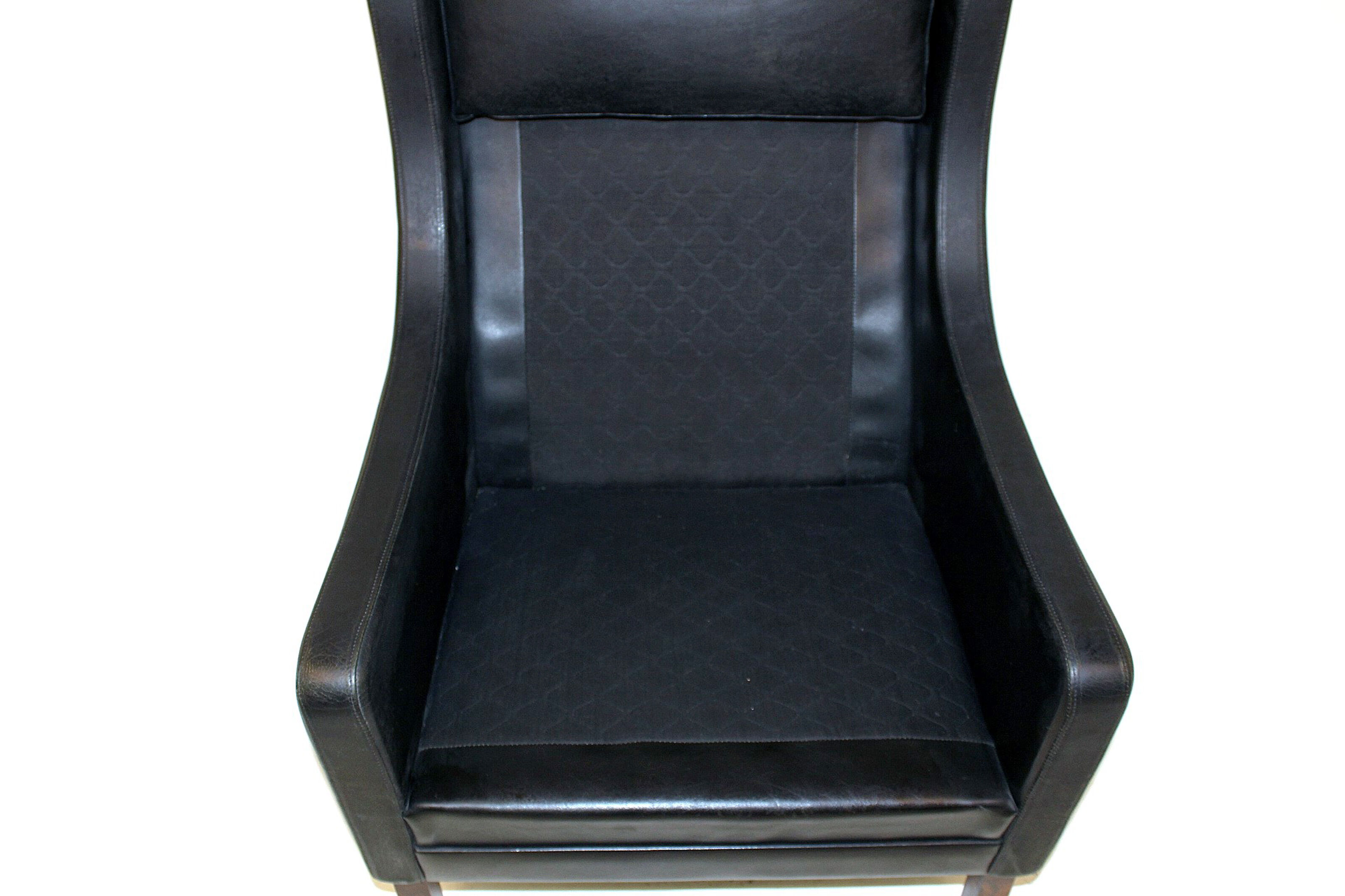 Fauteuil en cuir et palissandre Danemark 1960