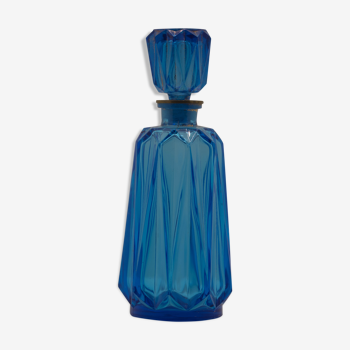 Blue chiseled glass bottle