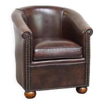 luxury dark leather club chair with English-style ball feet