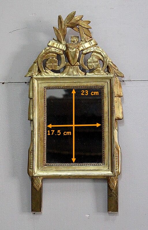 Miroir en bois doré, style Louis XVl, début XXe