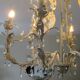 Large cage chandelier in aged metal.