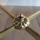 Round coffee table in brass with a black lacquered glass top by Maison Jansen.