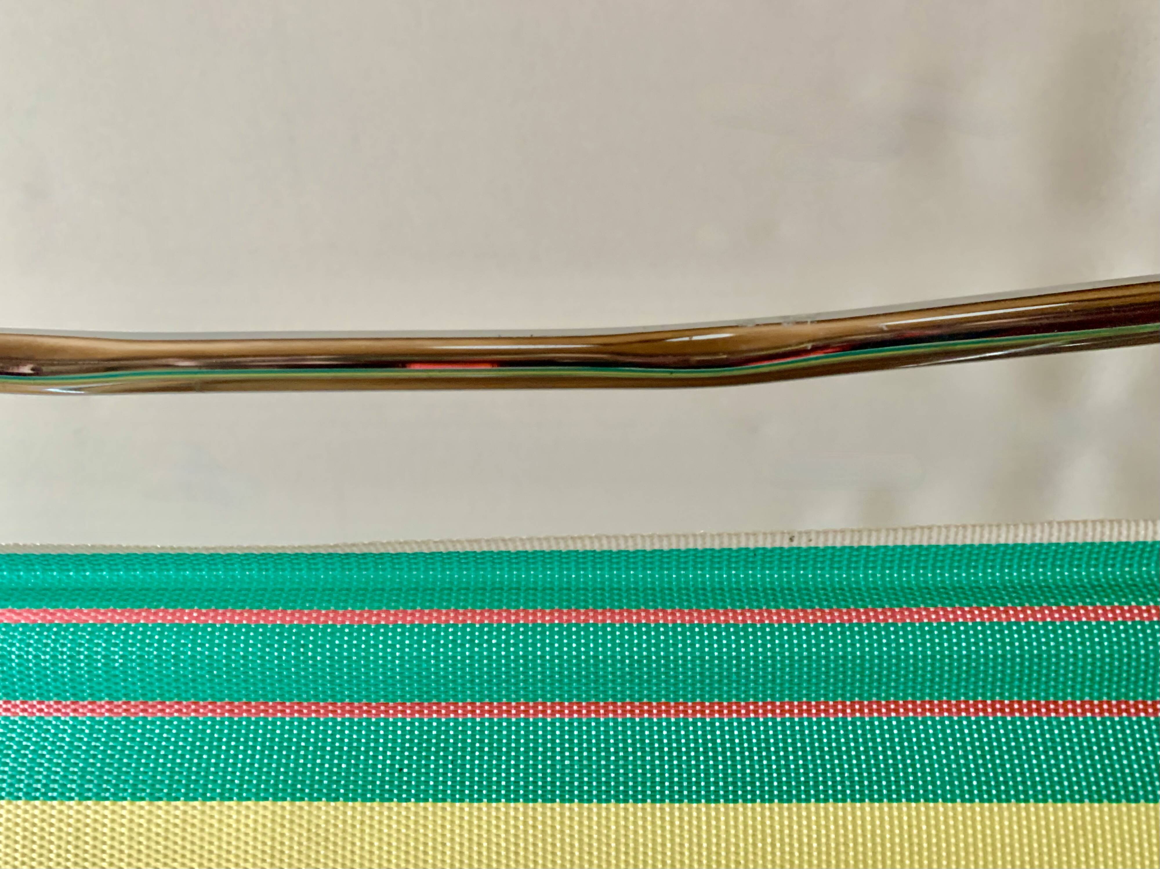 Vintage folding beach chair in chrome metal and woven plastic