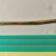 Vintage folding beach chair in chrome metal and woven plastic
