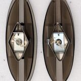 Pair of elliptical italian wall lamps in smoked glass and chrome veca