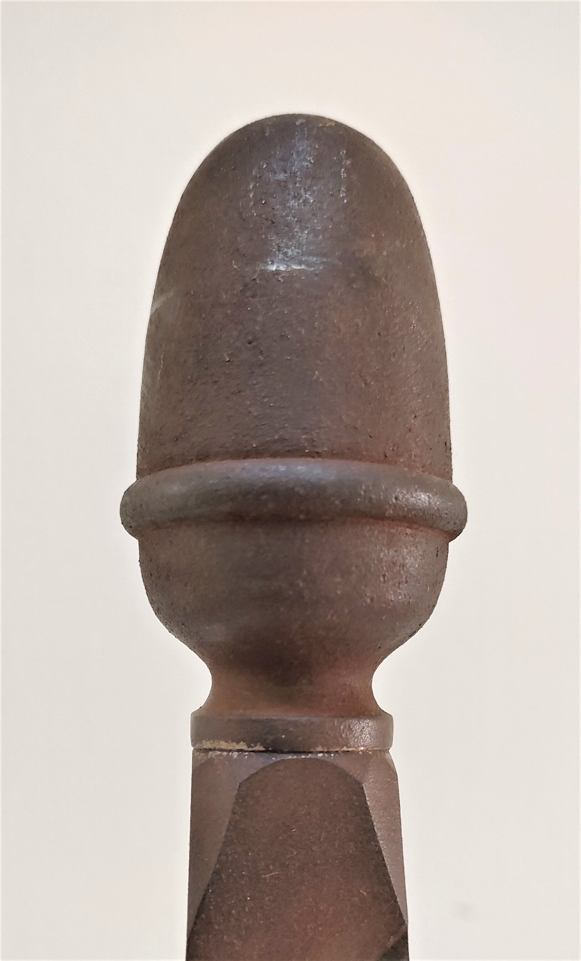 Pair of sculptural cast iron chenets with twisted heads