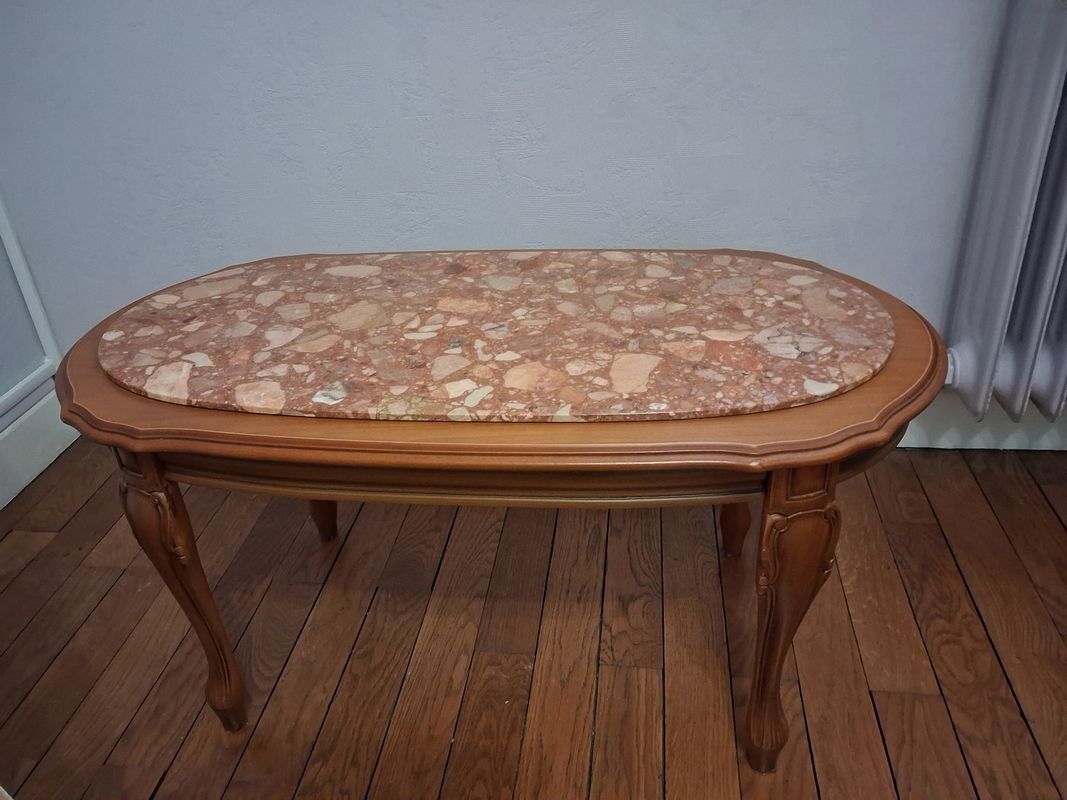 Coffee table with a stone top.