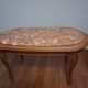 Coffee table with a stone top.