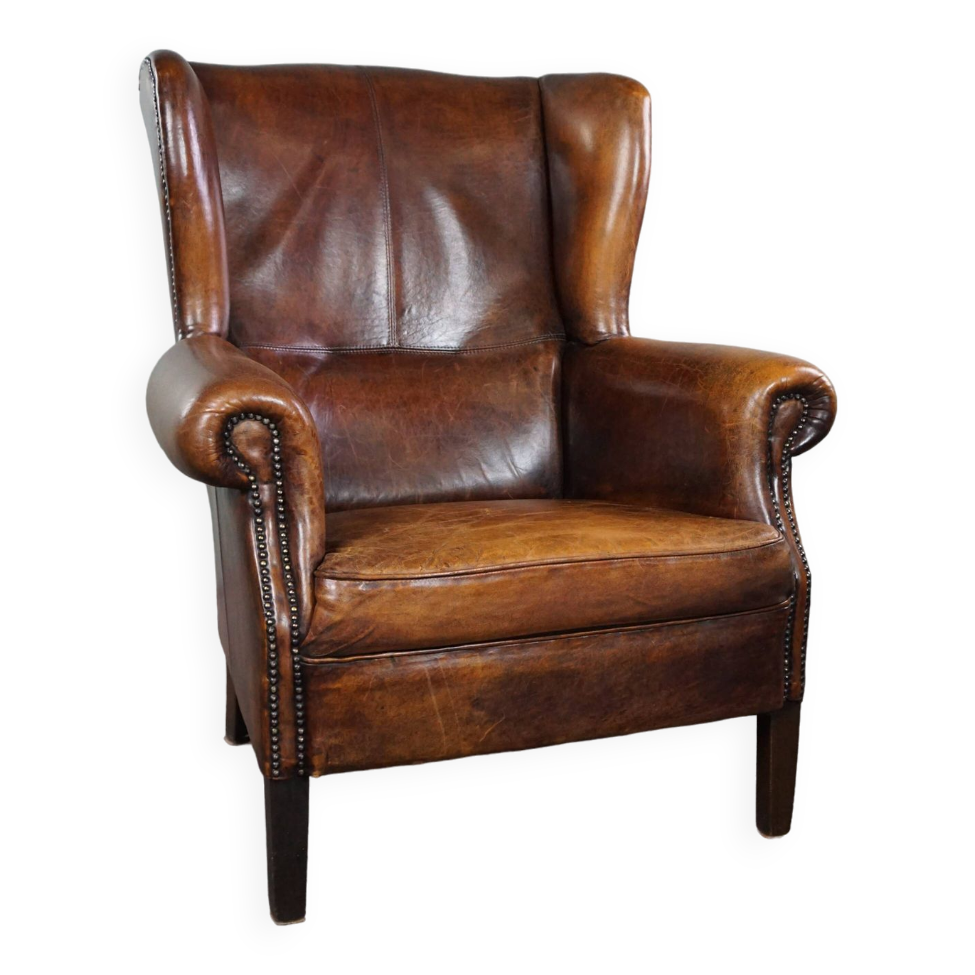 Dark wingback armchair made of sheep leather with stunning colors