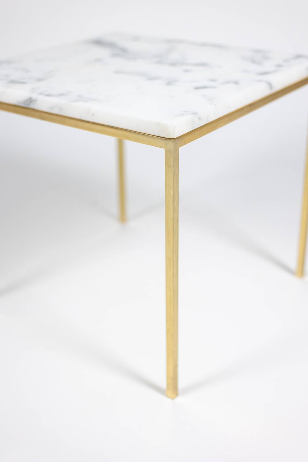 Pair of marble and gilt bronze end tables. 1970s.