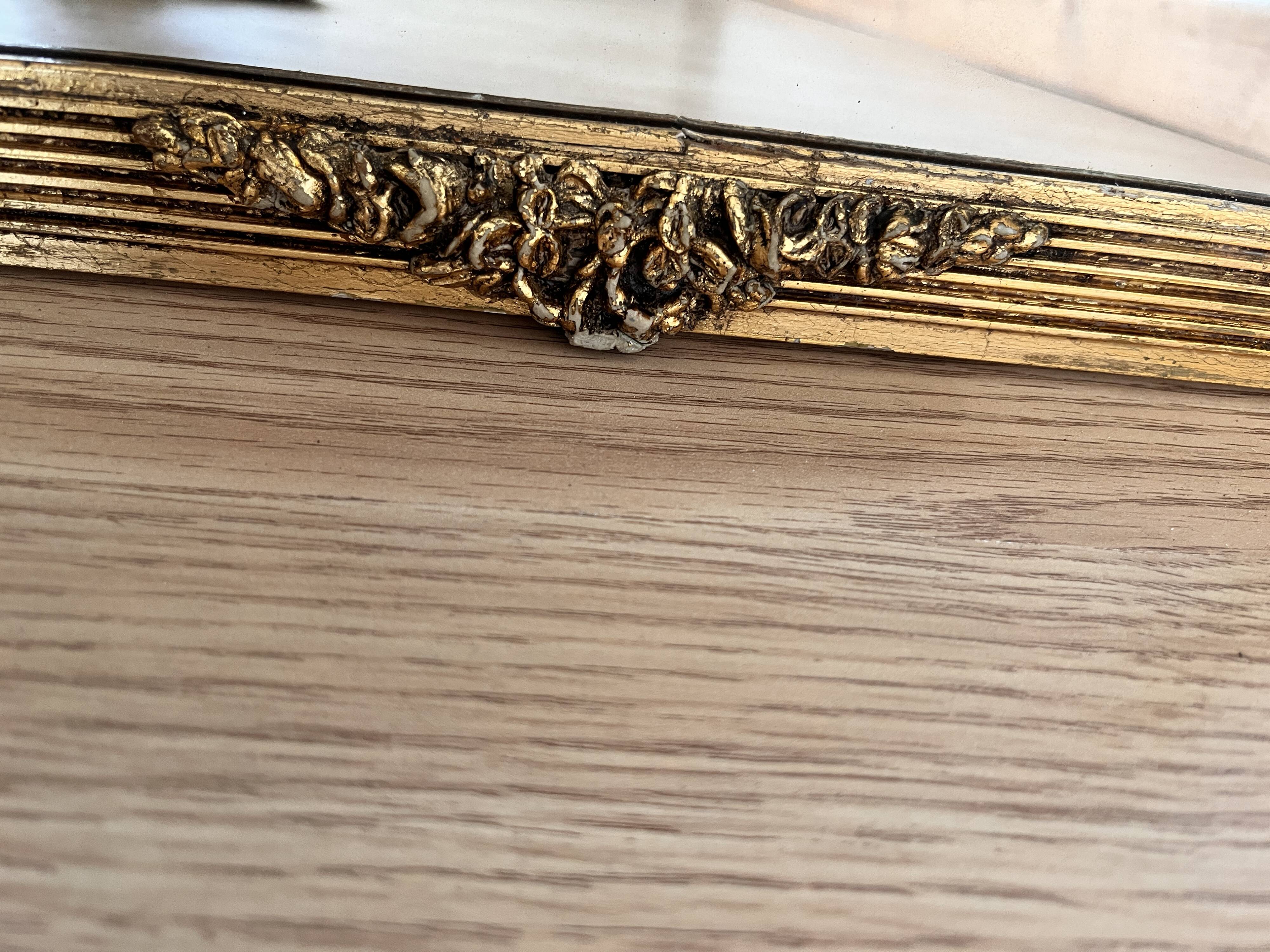 Golden mirror in Louis XVI style