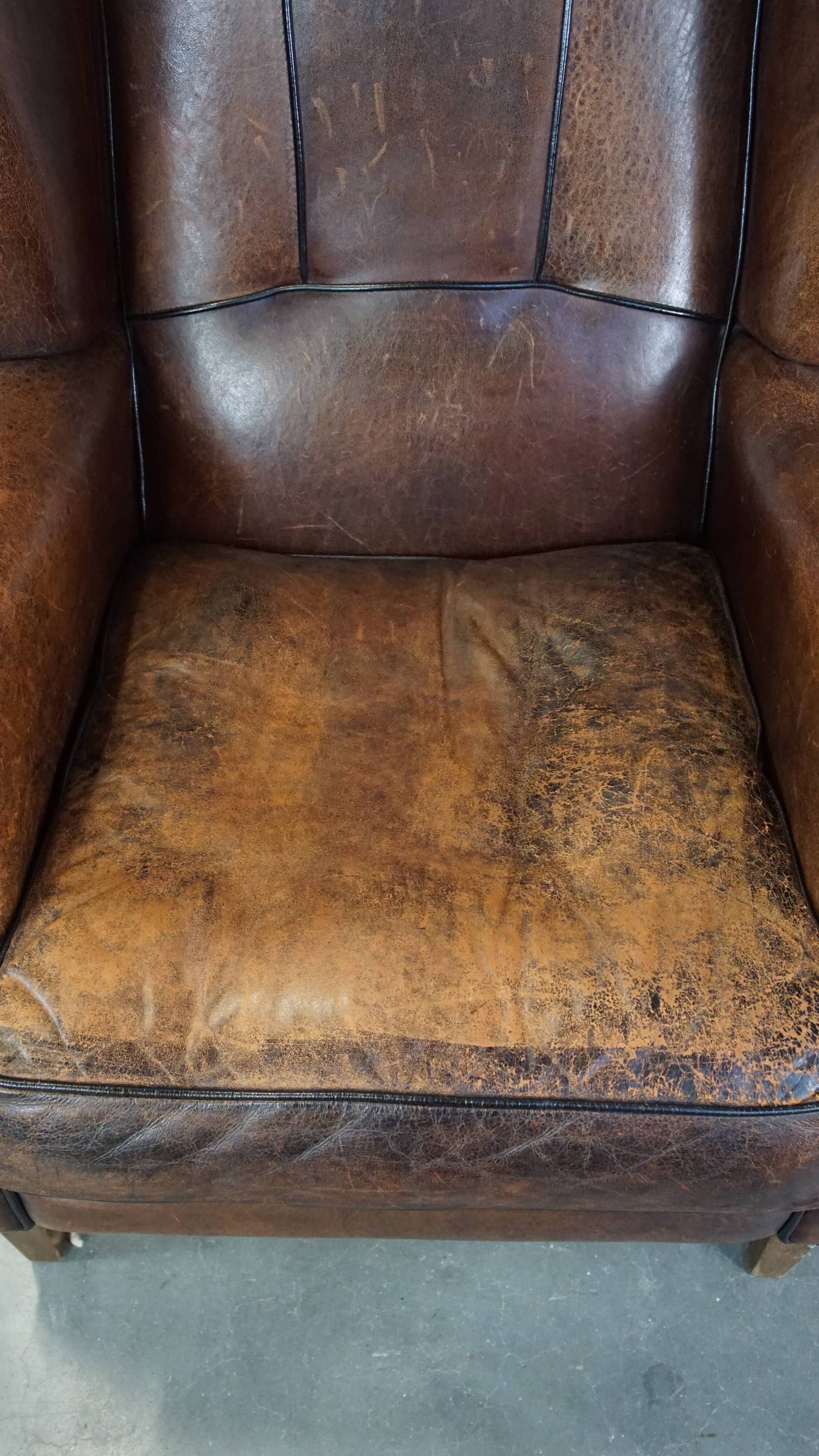 Sheep leather wing chair with patina