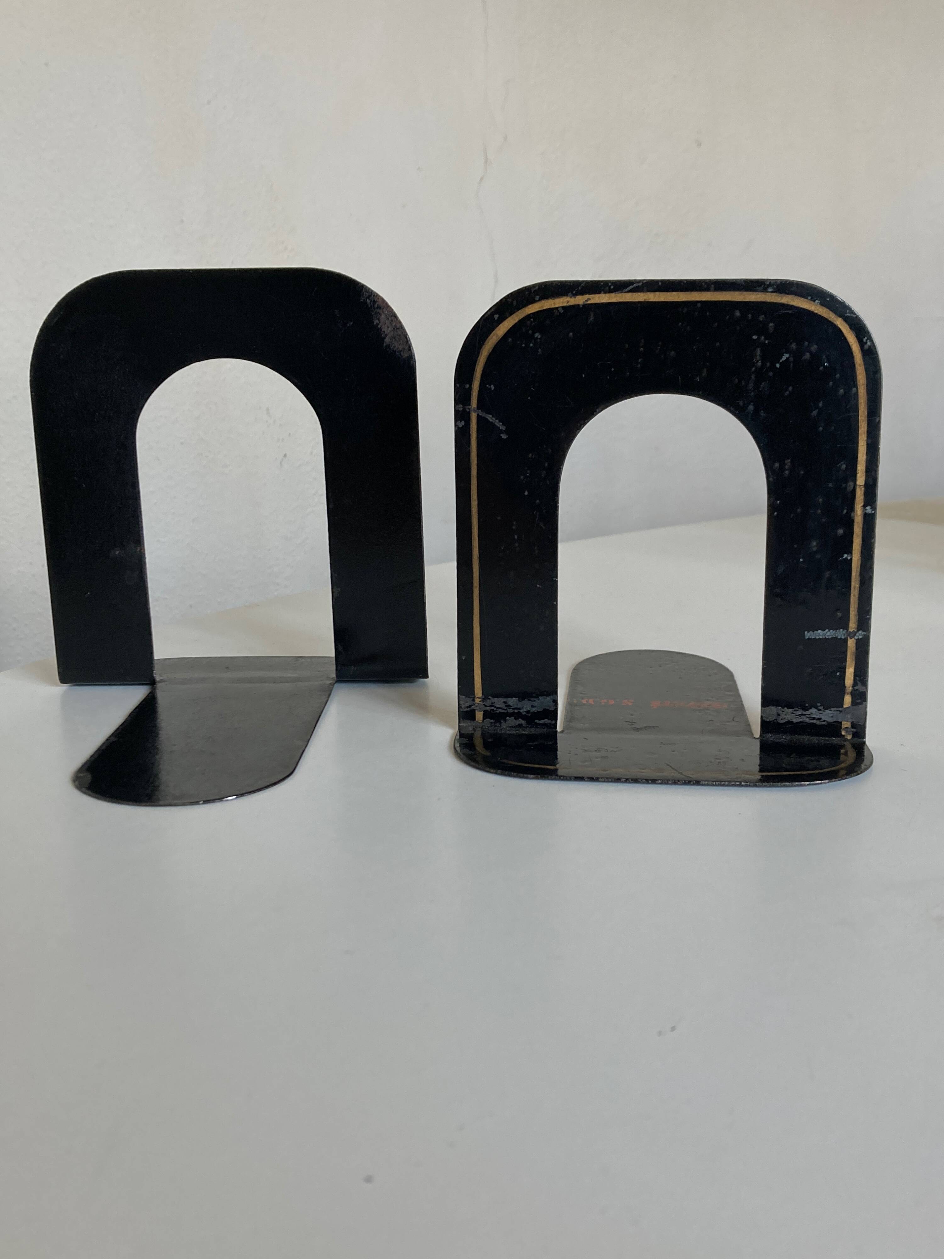 Pair of heavy metal bookends, folded, 1920.