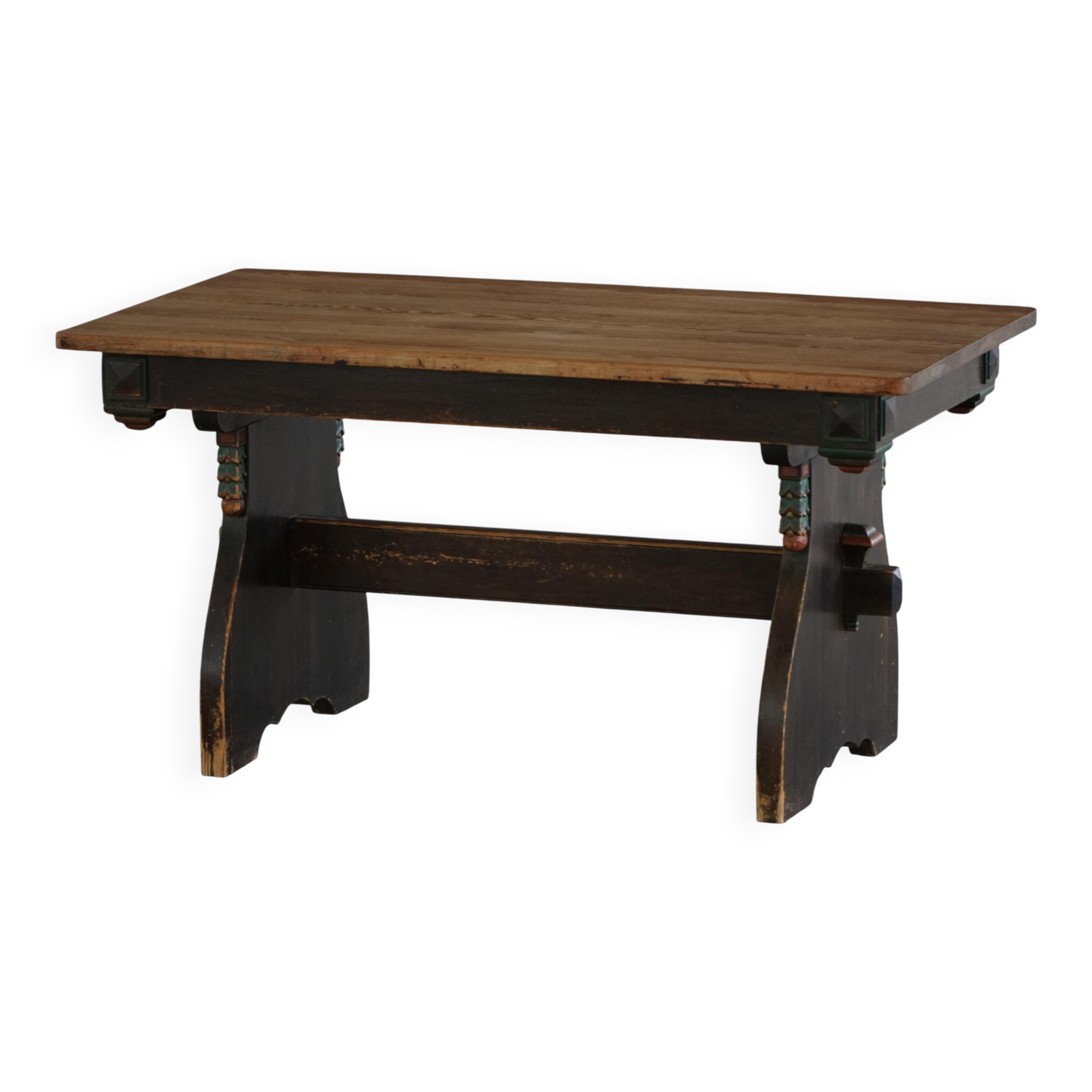 Rustic Scandinavian dining table in stained pine, Sweden, 1900-1940.