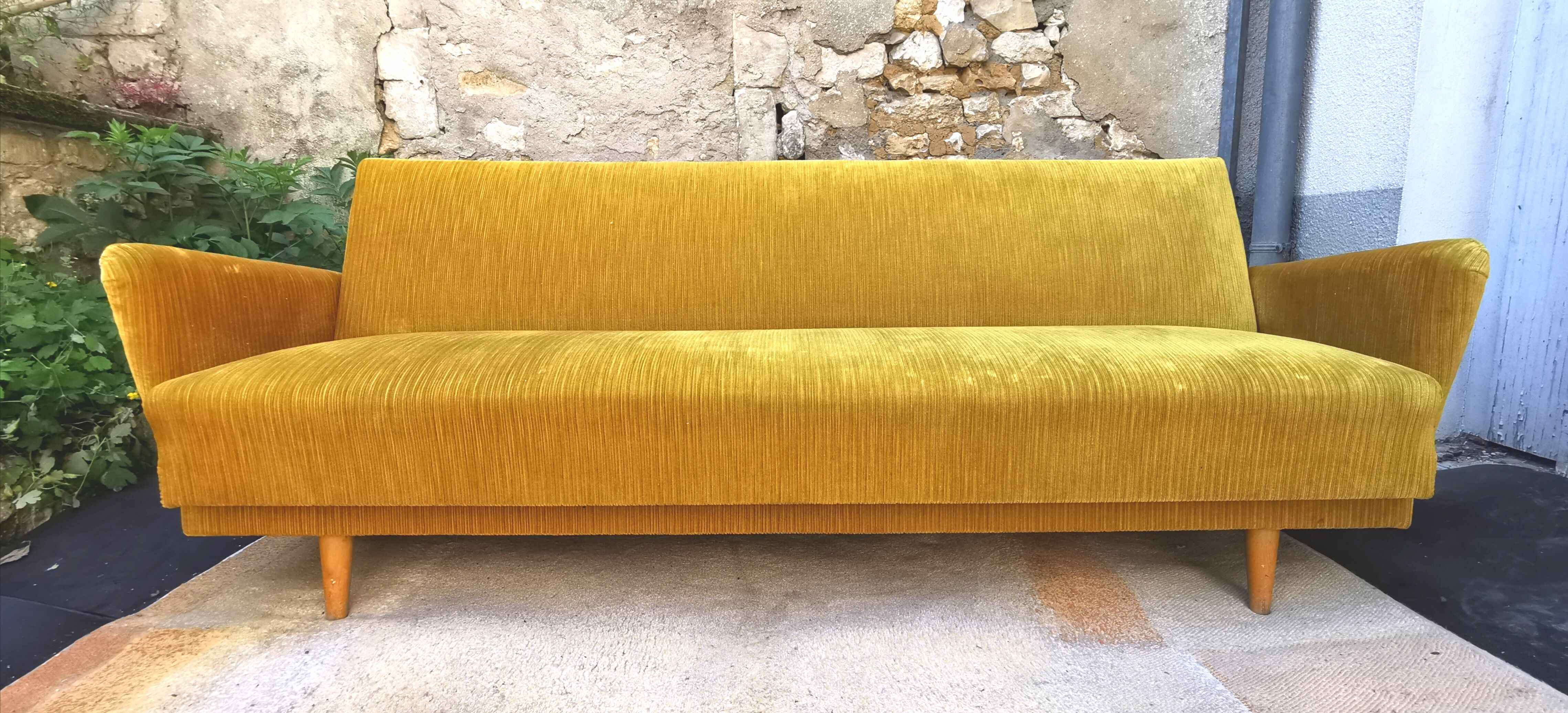 Convertible sofa in golden yellow velvet