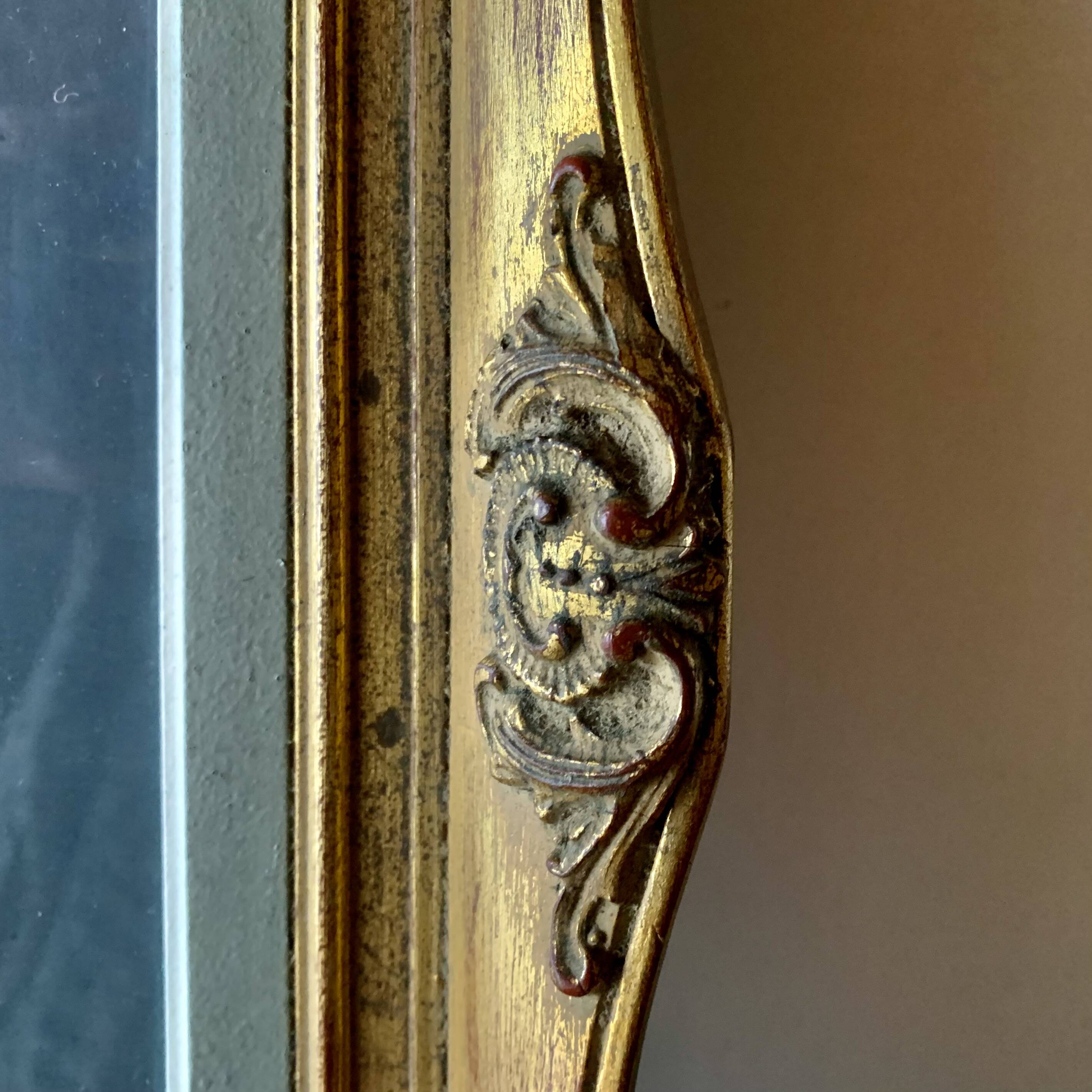 Old gilded carved wooden wall frame
