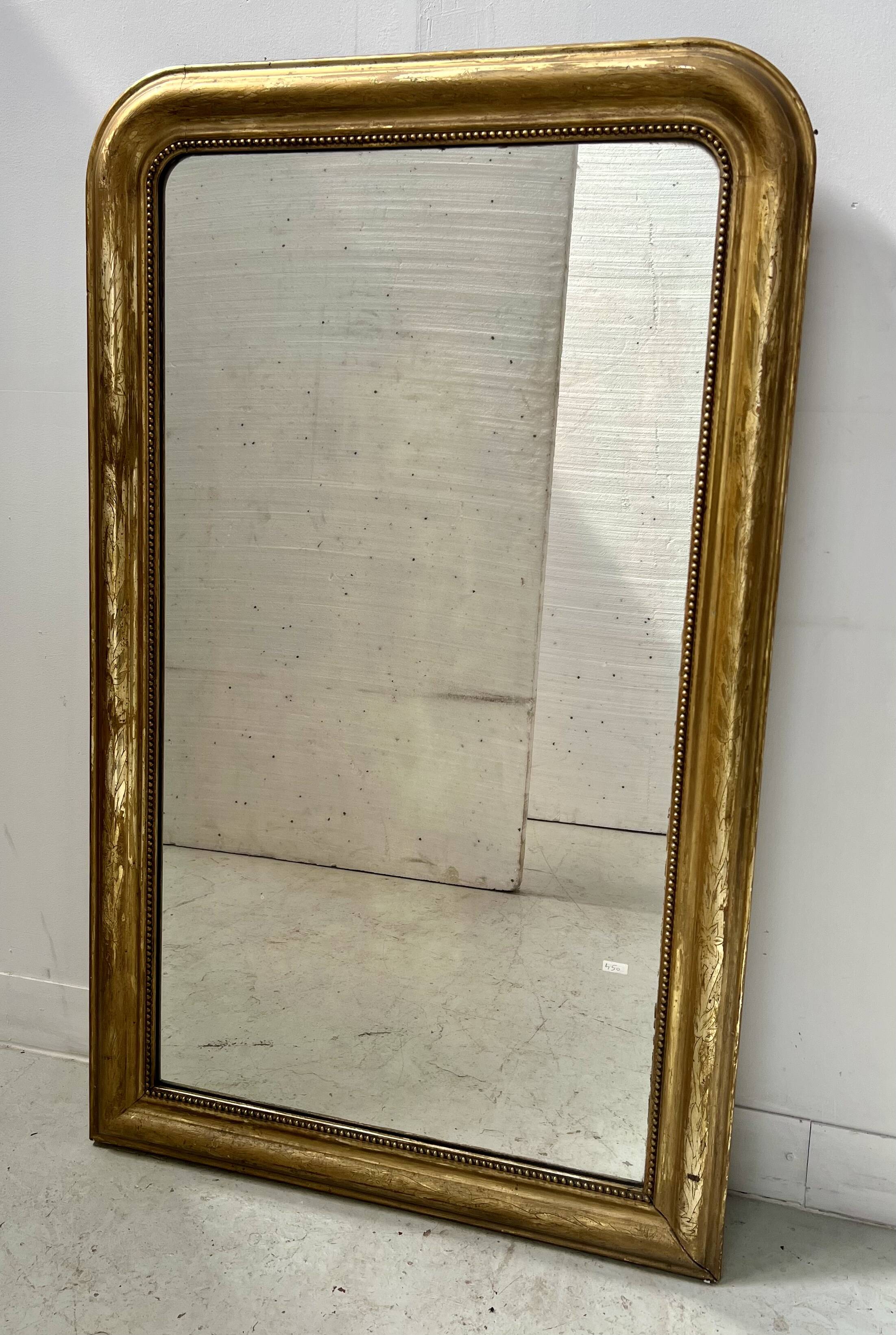 Louis Philippe mirror in wood and gilded stucco, 19th century