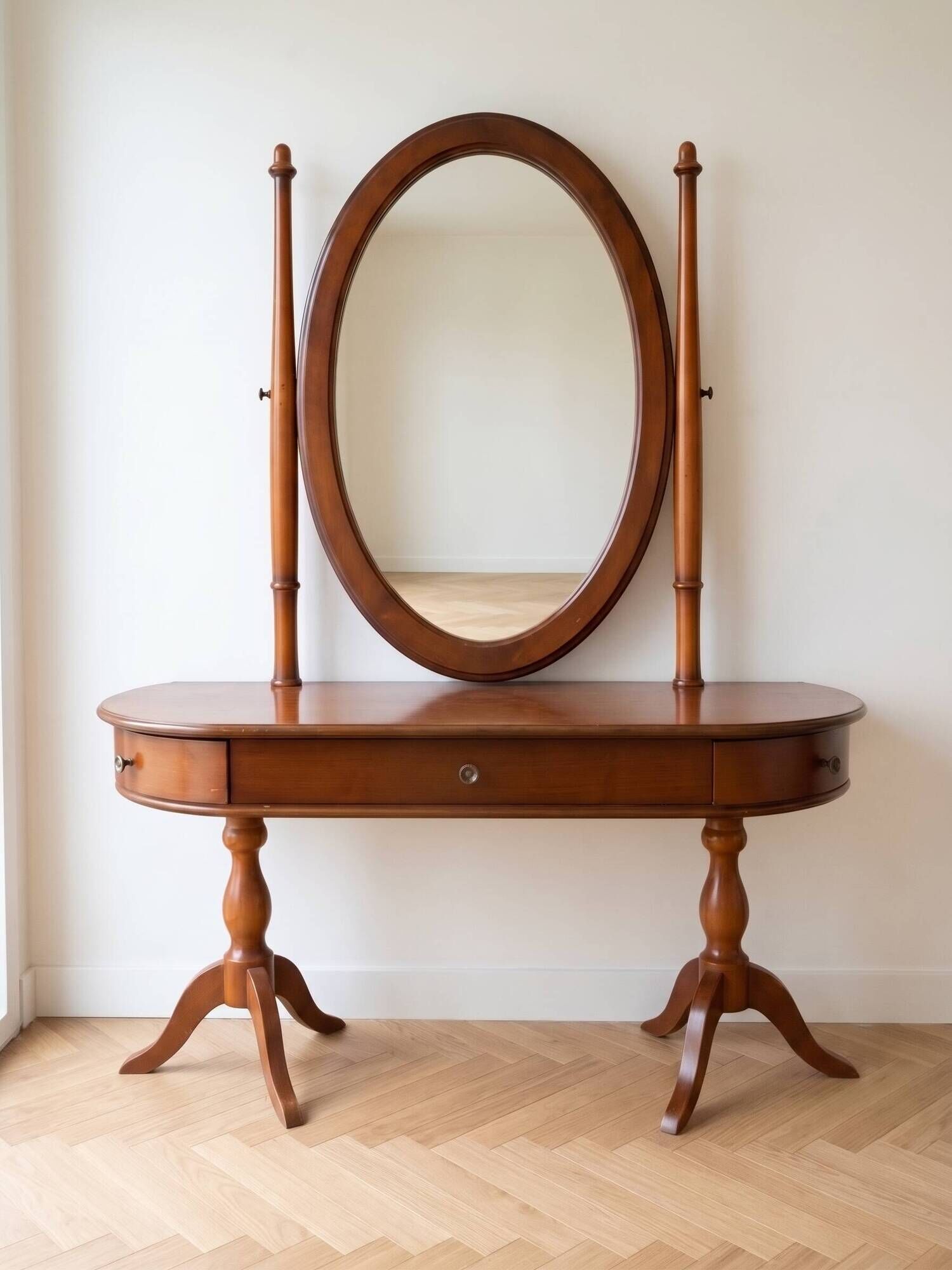 Traditional wooden dressing table with oval mirror.