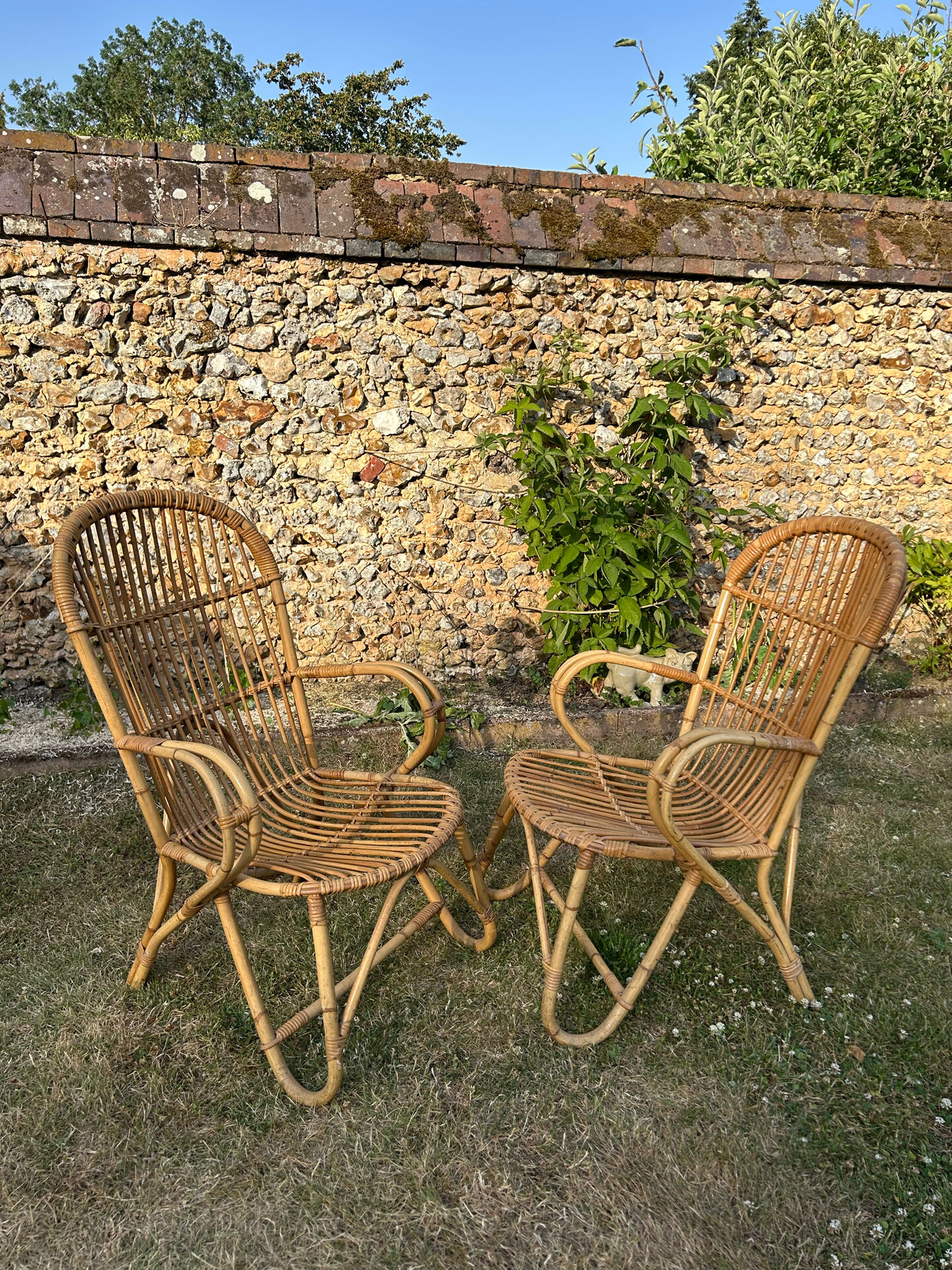 Pair of vintage rattan armchairs from the 1960s.