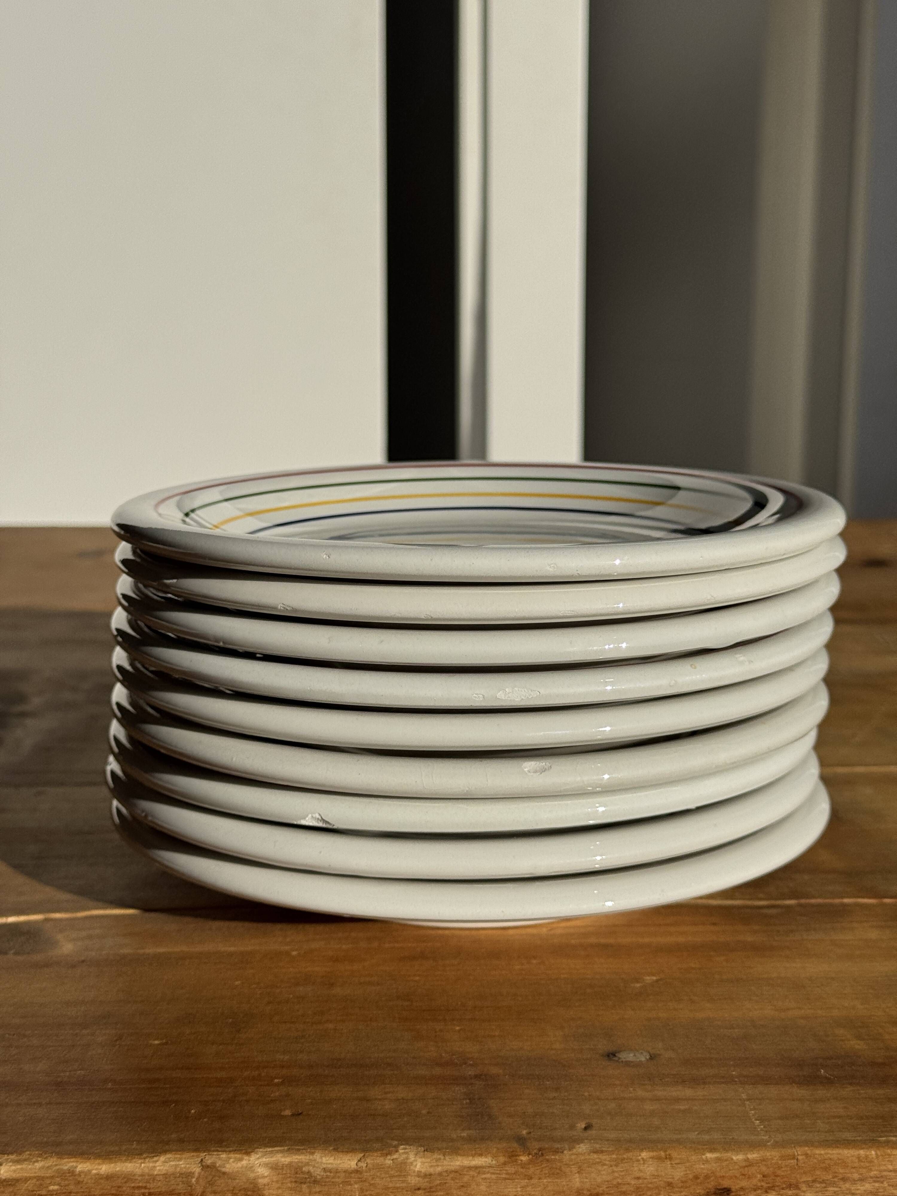Set of 9 small Italian dessert plates Primula with red and green trim.