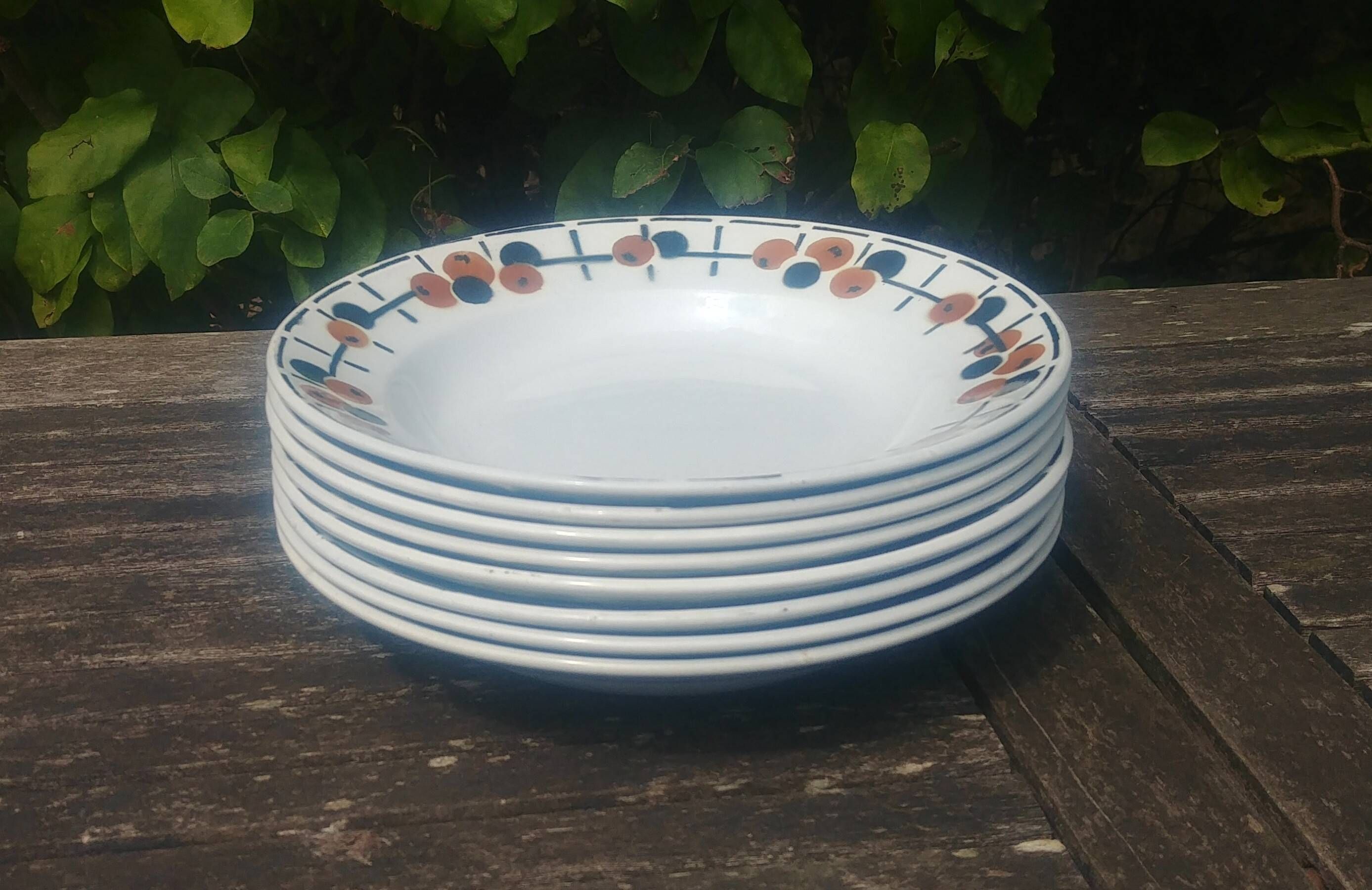 Set of eight ironstone soup plates from the Saint Amand earthenware factory
