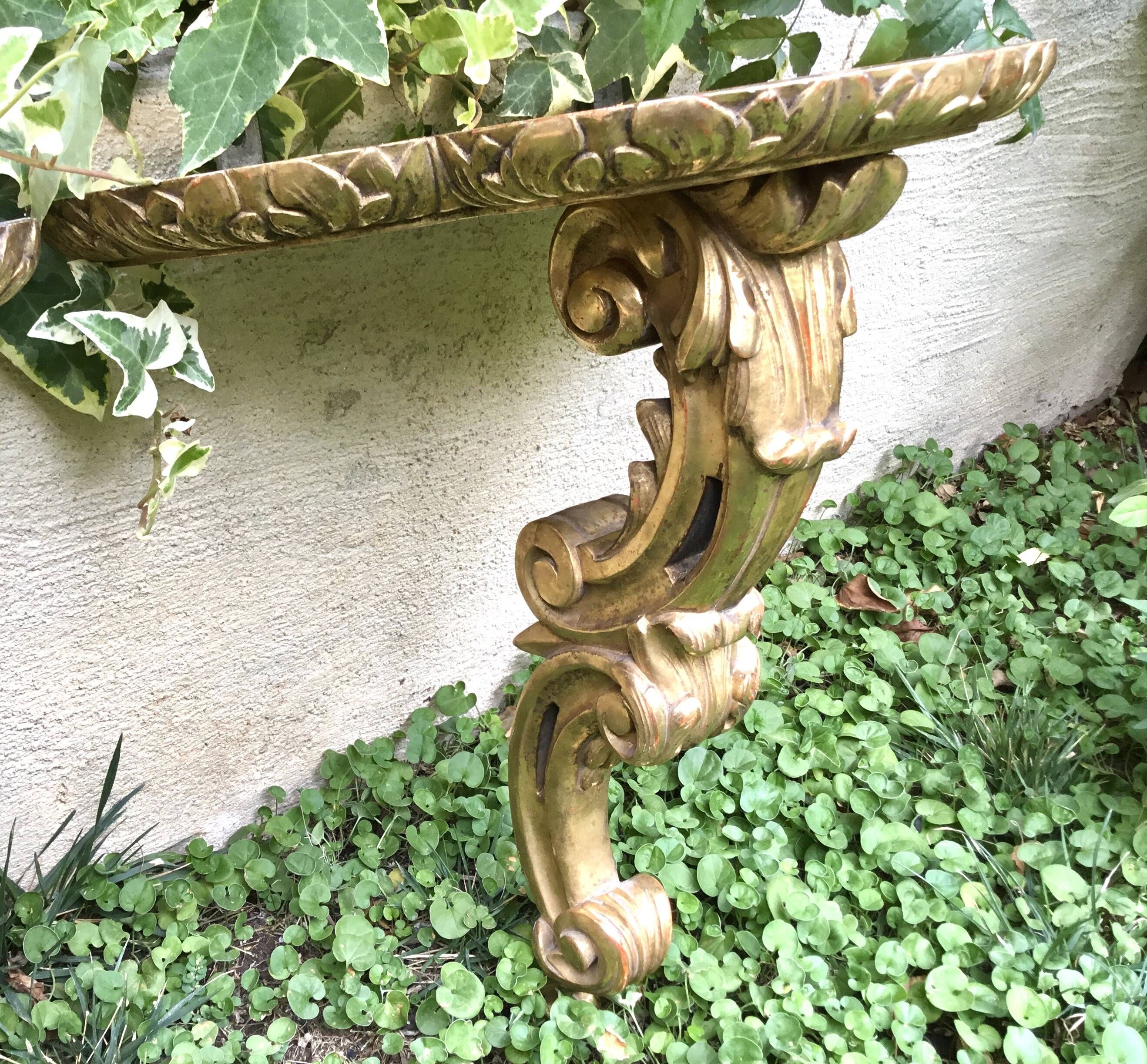 Important, pair of wooden consoles with gilded stucco in Louis XV style. XIX century.