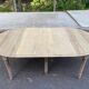 Round extendable dining table with flaps, stripped in raw oak, with 3 extensions.