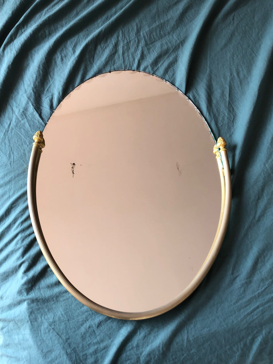 Beveled wall mirror with gold frame